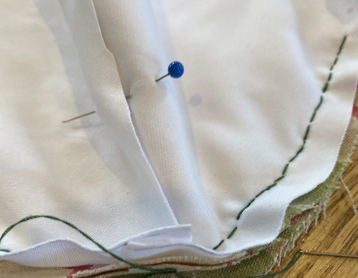 Double back on your sewing to make a solid seam, then continue the other direction from the center and continue aligning the edges.